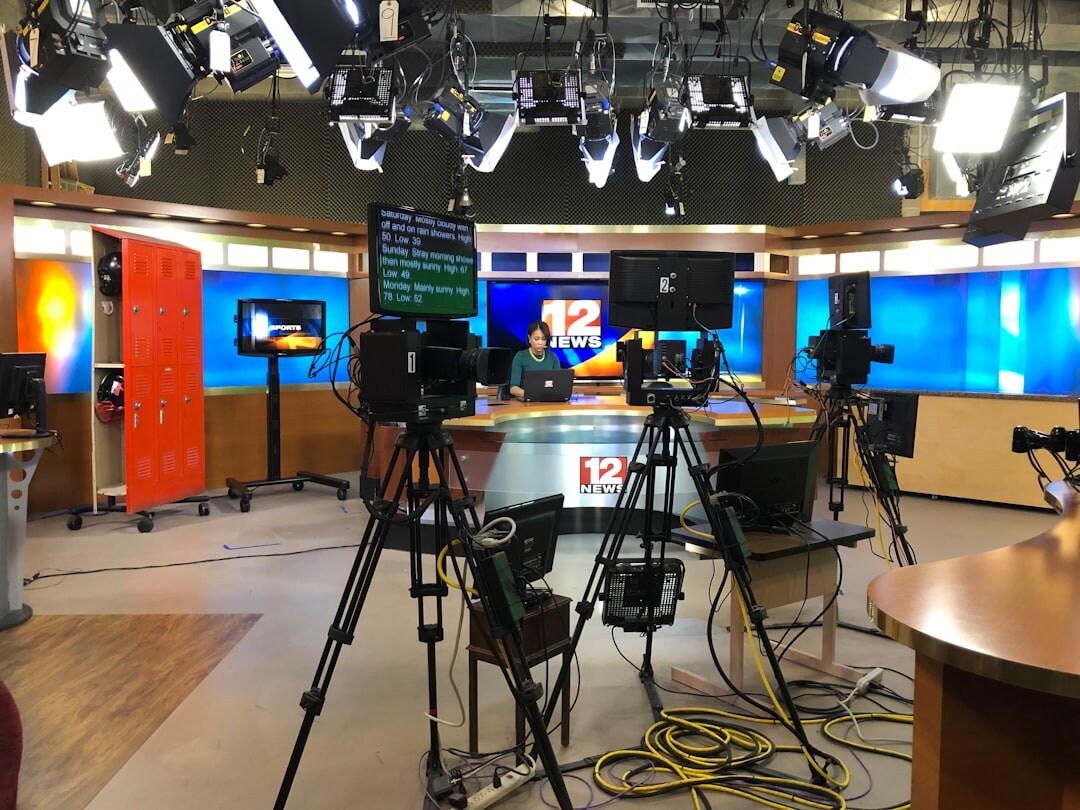 Professional broadcast control room with signal monitors and multiple displays
