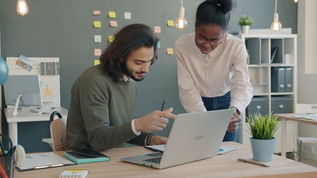 Diverse team of broadcast professionals collaborating in a modern office
