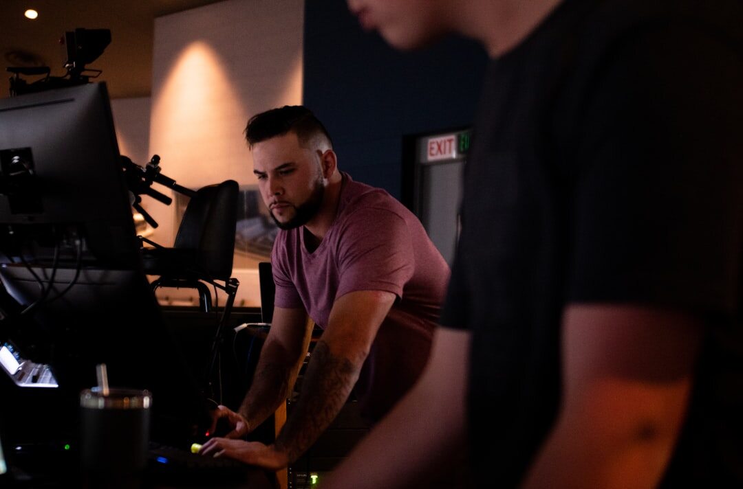 Broadcast professionals reviewing live signal data on monitors